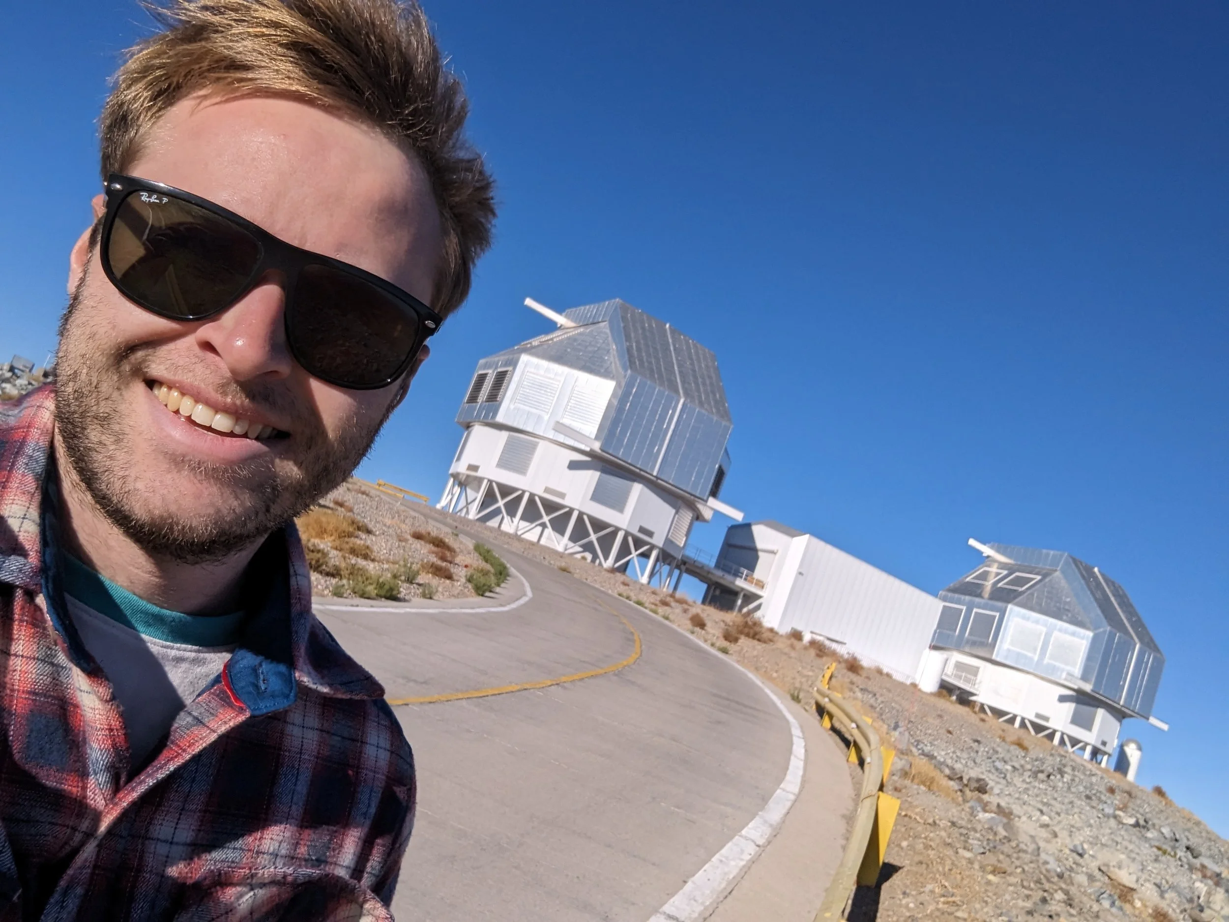 Cameron Pfeffer with the Magellan telescopes at Las Campanas Observatory in Chile